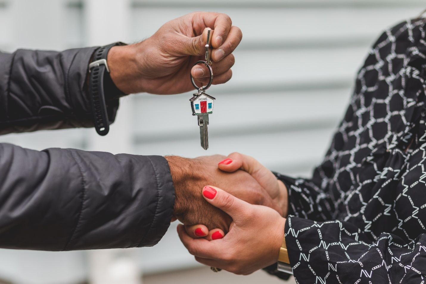 Real Estate Agent Handing Over Keys